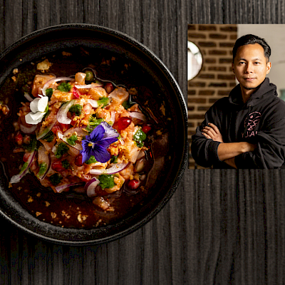 Nikkei inspired hamachi-ceviche met een Leche de Tigre dressing, granaatappel en infused kruidenolie
